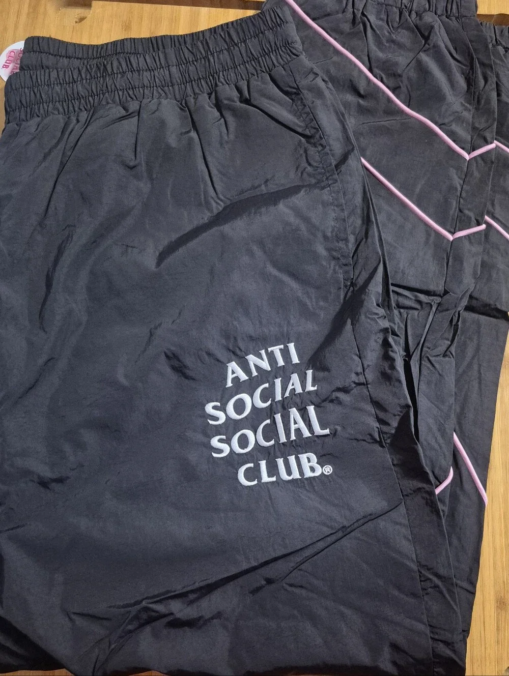 Anti Social Social Club Black Track Pants with Pink Piping and White Logo